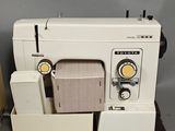 a sewing machine that is sitting on a table