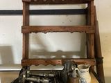 a wooden shelf with tools on top of it