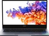a close up of a laptop computer on a white surface