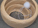 a basket with a ball inside of it on the ground