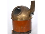 an old fashioned copper and brass fire hydrant on a white background
