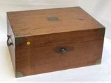 a wooden box with a metal handle on a white background