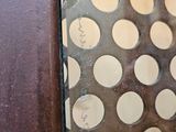 a glass door with a hole in it that has holes in it
