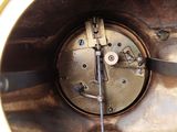 a close up view of a clock with a metal case