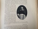 an open book with a black and white photo of a man in a priest ' s robes
