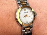 a woman that is wearing a watch on her wrist