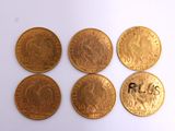 six different types of gold coins with the names of different countries
