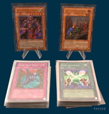 three cards are on display on a table with a blue background