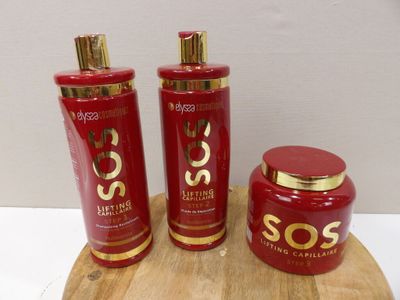 three bottles of soap sitting on a cutting board
