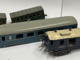 three toy trains sitting next to each other on a table