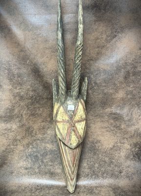 a close up of an animal head on a leather surface