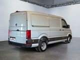 an image of a silver van parked in a garage