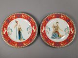 pair of chinese porcelain plates with figures on them