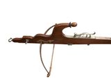 an old wooden gun with a bow and arrow on a white background