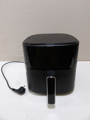 an image of a black toaster on a white table