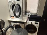 a washer and dryer in a small room