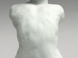 an image of a white sculpture of a person sitting on the ground