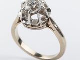 a close up of a diamond ring on a white background