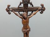 a statue of jesus on a cross on a table