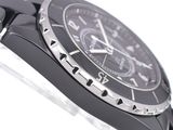 a close up of a watch on a white surface