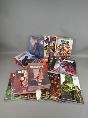 a pile of comics sitting on top of each other on a table