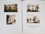 an open book with pictures of a building on it