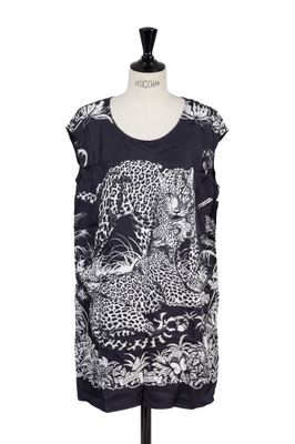 a black and white top with a leopard print on it