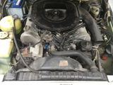 a picture of a car engine in the trunk of a car