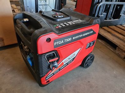 the portable generator is sitting on the floor in the warehouse