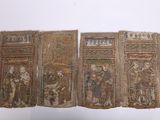 quatre morceaux de tissu sur lesquels sont représentés des personnages et des animaux