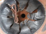 a close up of a metal object with a rope in it
