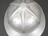 a silver helmet with a star design on it
