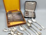 an assortment of silverware including spoons, forks and spoons