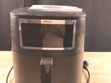 a microwave sitting on top of a wooden table