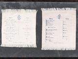 framed photograph of a menu and a menu card on a table