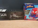 a box of spider - man remote control car next to a box of remote control car