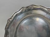 a silver plate that is sitting on a table