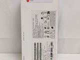 the back of a white box with a black and red sticker on it