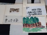 a picture of a bunch of drawings on a table