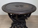 an image of a wooden table with a metal base on a wooden floor
