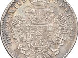 an old silver coin with a crown on top of it