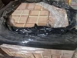 a box of bricks sitting on a pallet in a warehouse