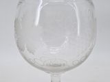 a wine glass that is sitting on a table