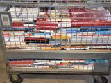 a metal cart with many books on top of it