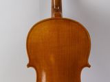 an old violin sitting on a white surface with a white background