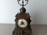 a small clock that is sitting on a table