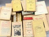 a lot of books that are sitting on a table