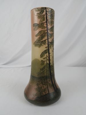 a vase that has a picture of a tree on it