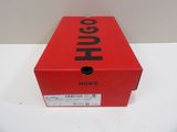 the box is red and black with the word hugo on it