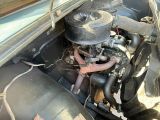 an old car engine in the back of the truck